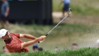 Imagem de Scottie Scheffler estreia-se a vencer o Open britânico